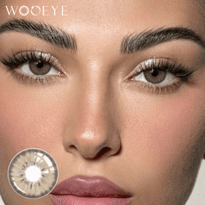 The girl's face is looking straight ahead, the upper left is the Wooeye logo, and the lower left is a close-up of the mocha hazel brown contact lens