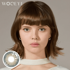 The girl's face is looking straight ahead, the upper left is the Wooeye logo, and the lower left is a close-up of the Wooeye Dancer Deep Green Contact Lenses