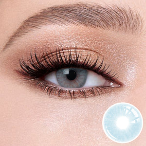 The effect of wearing Mulberry Blue Contact Lenses, with a close-up of the product in the lower right corner