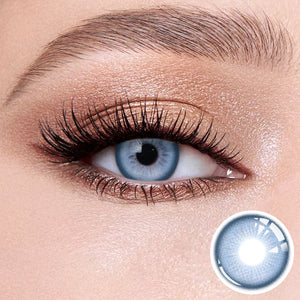 The effect of wearing Sweet Blue Contact Lenses, with a close-up of the product in the lower right corner