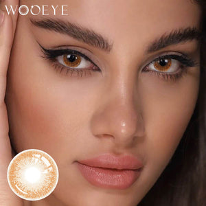 The girl's face is looking straight ahead, the upper left is the Wooeye logo, and the lower left is a close-up of the Coffee Gray contact lens