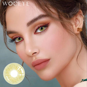 The girl's face is looking straight ahead, the upper left is the Wooeye logo, and the lower left is a close-up of the Banshe Green contact lens