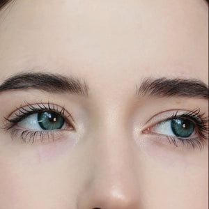 Close-up of face wearing Diamond Green I Contact Lenses