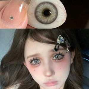 Close-up of face and product wearing Diamond Green I Contact Lenses