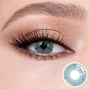 The effect of wearing Plato Blue Contact Lenses, with a close-up of the product in the lower right corner