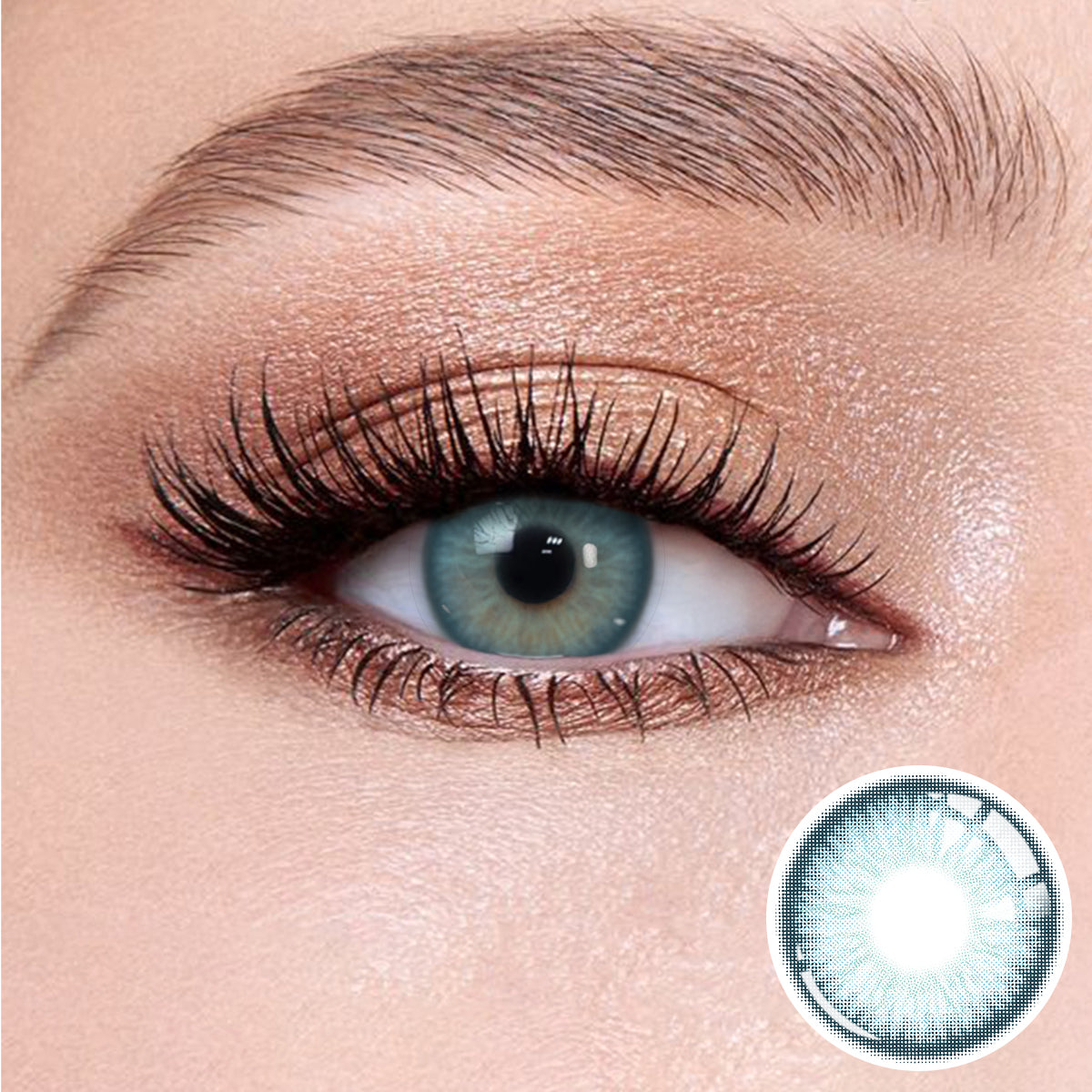 The effect of wearing Elf Blue Contact Lenses, with a close-up of the product in the lower right corner