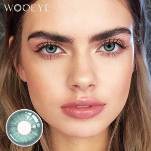 The girl's face is looking straight ahead, the upper left is the Wooeye logo, and the lower left is a close-up of the amber blue contact lens