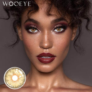 The girl's face is looking straight ahead, the upper left is the Wooeye logo, and the lower left is a close-up of the Mermaid Brown contact lens