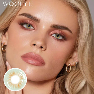 The girl's face is looking straight ahead, the upper left is the Wooeye logo, and the lower left is a close-up of the molly green contact lens