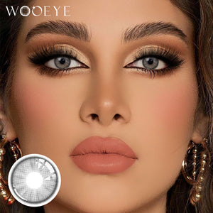 The girl's face is looking straight ahead, the upper left is the Wooeye logo, and the lower left is a close-up of the trends gray contact lens