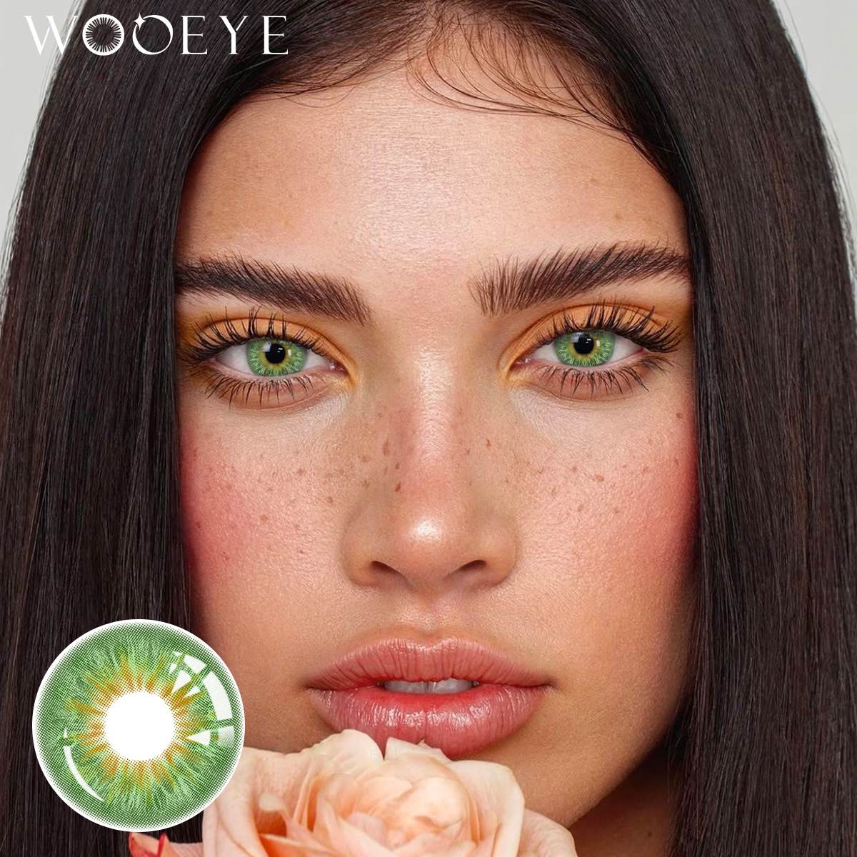 The girl's face is looking straight ahead, the upper left is the Wooeye logo, and the lower left is a close-up of the Vegas Green contact lens