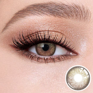 The effect of wearing Alice Brown Contact Lenses, with a close-up of the product in the lower right corner