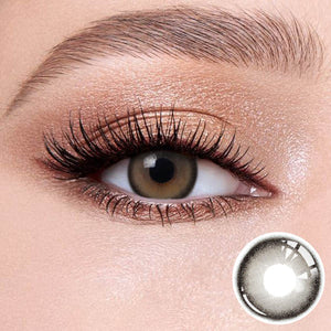 Black Pearl Gray contact lenses on the eyes, close-up of the product on the lower right