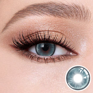 The effect of wearing Boston Blue Contact Lenses, with a close-up of the product in the lower right corner