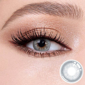 Cape Cod Blue contact lenses on the eyes, close-up of the product on the lower right