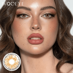 The girl's face is looking straight ahead, the upper left is the Wooeye logo, and the lower left is a close-up of the Cleo Hazel Brown contact lens