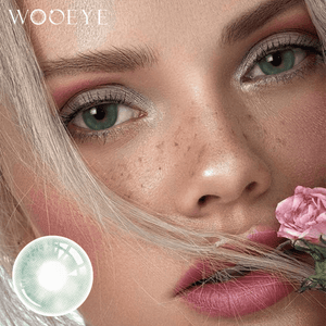 The girl's face is looking straight ahead, the upper left is the Wooeye logo, and the lower left is a close-up of the CloudsGreen contact lens