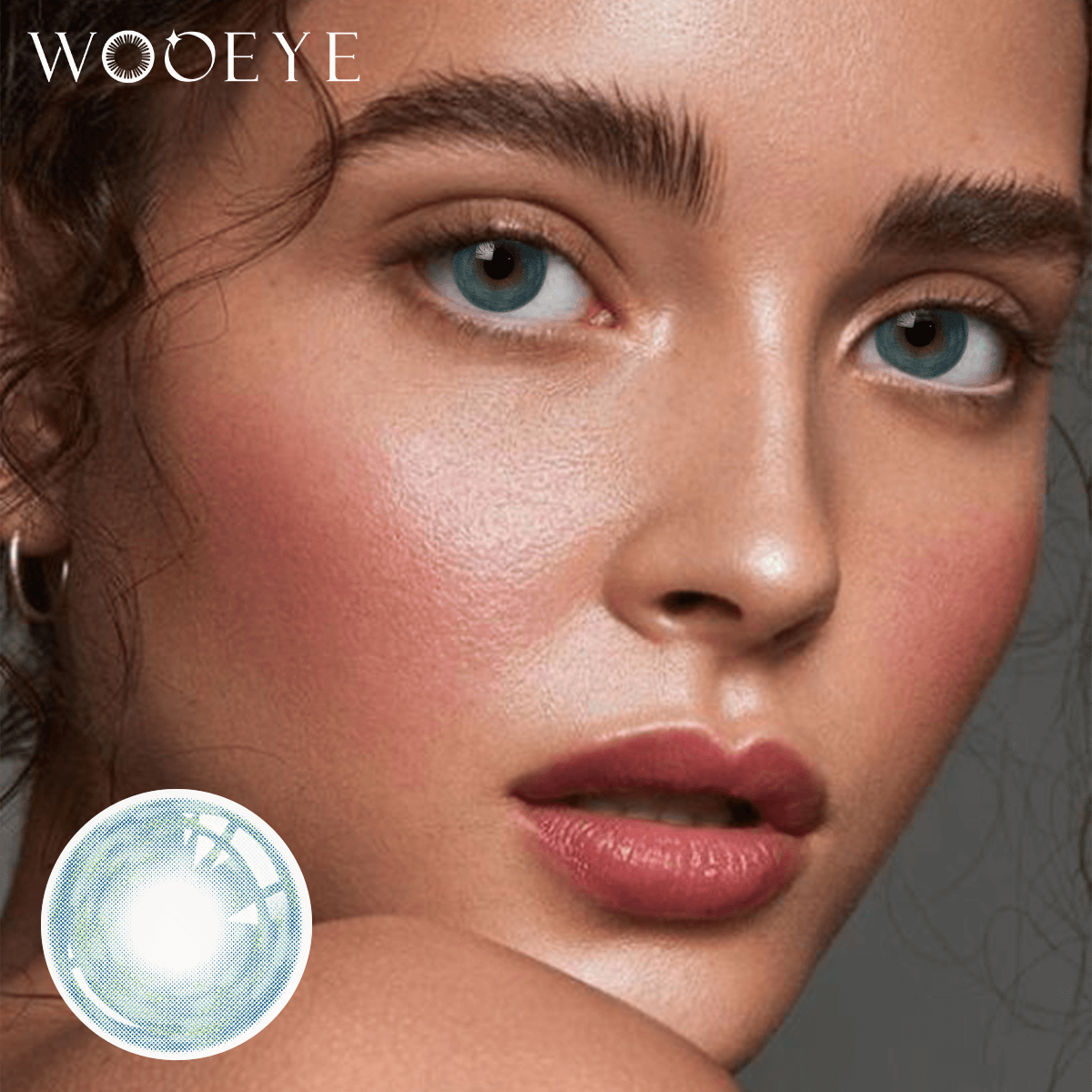 The girl's face is looking straight ahead, the upper left is the Wooeye logo, and the lower left is a close-up of the Cosmos Blue contact lens