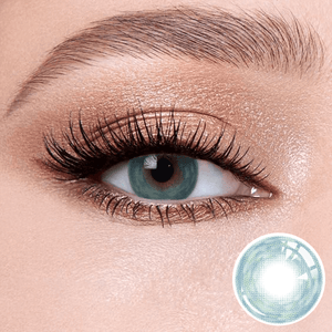 Cosmos Blue contact lenses on the eyes, close-up of the product on the lower right