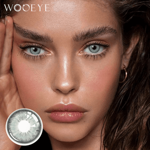 The girl's face is looking straight ahead, the upper left is the Wooeye logo, and the lower left is a close-up of the Dancer Light Green contact lens