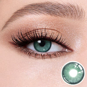 The effect of wearing Diamond Green I Contact Lenses, with a close-up of the product in the lower right corner