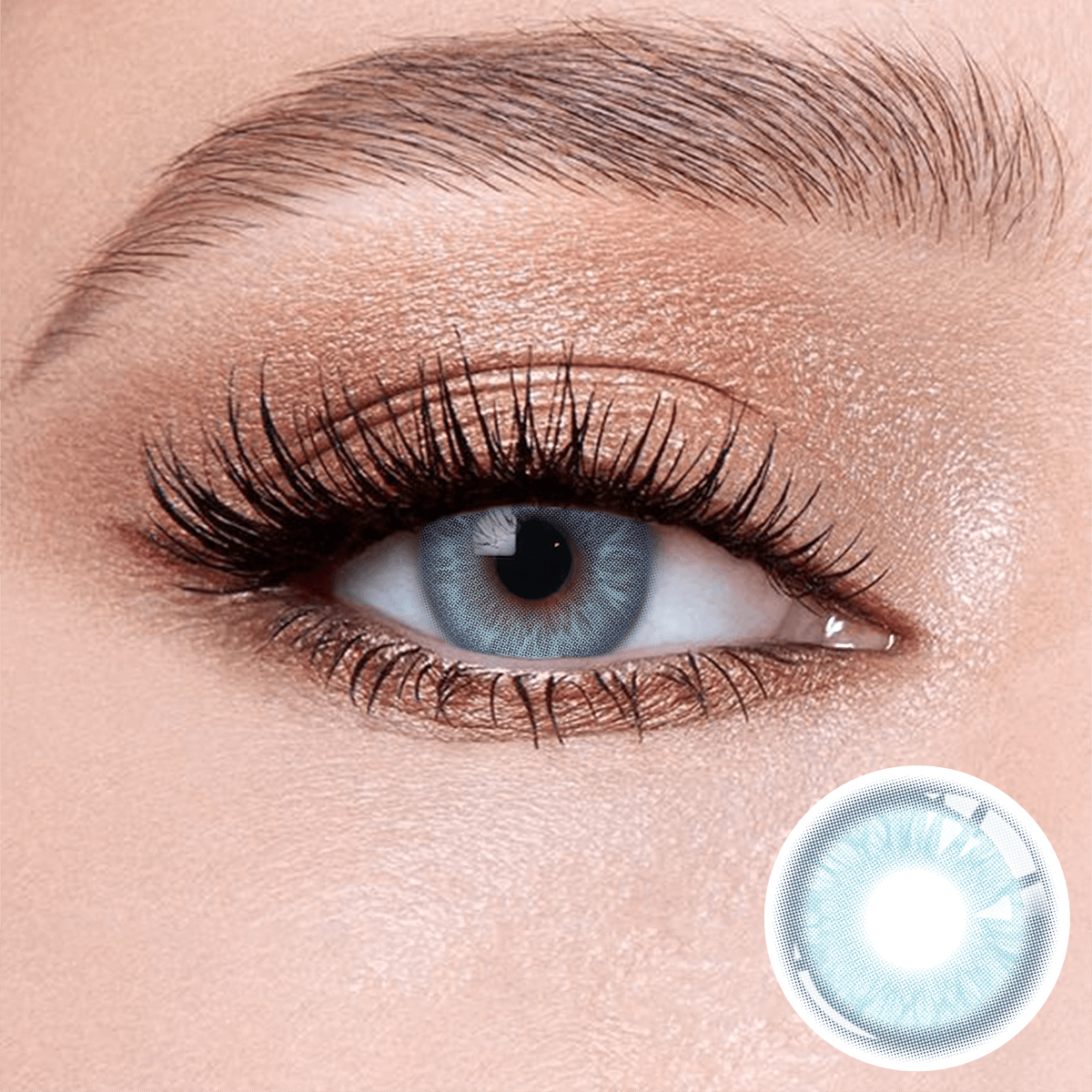 Glacier Blue contact lenses on the eyes, close-up of the product on the lower right