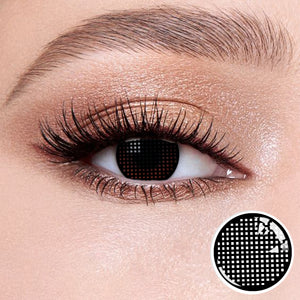 The effect of wearing Grid Black Contact Lenses, with a close-up of the product in the lower right corner