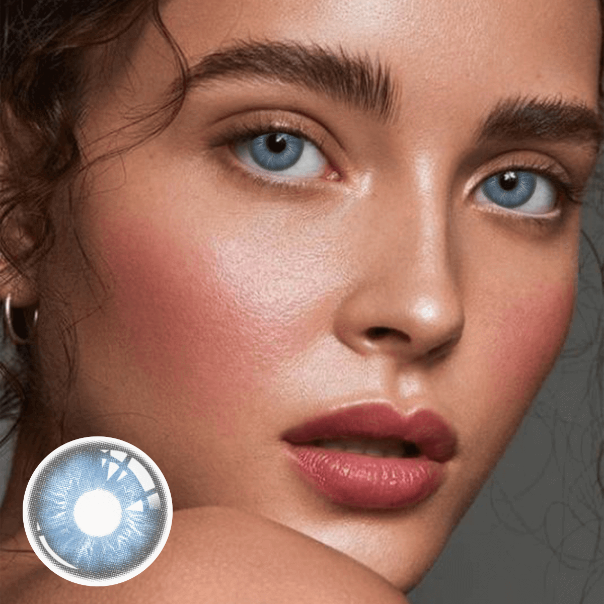 Woman is looking ahead. The lower left corner is Irish.Blue contacts product close-up