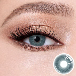 The effect of wearing Love Blue Contact Lenses, with a close-up of the product in the lower right corner