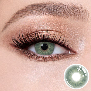 The effect of wearing Love Green Contact Lenses, with a close-up of the product in the lower right corner