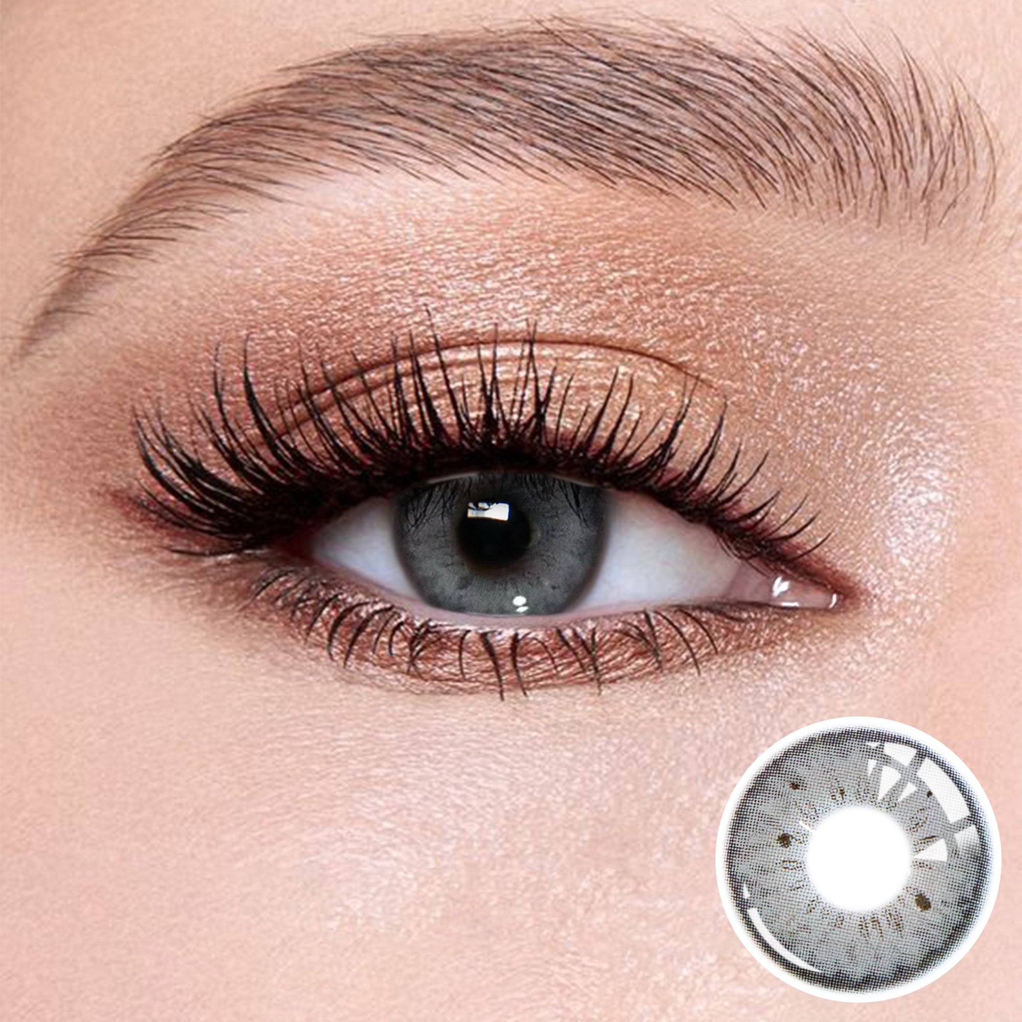 The effect of wearing Magic Grey Contact Lenses, with a close-up of the product in the lower right corner