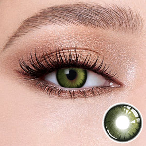The effect of wearing Night Green Contact Lenses, with a close-up of the product in the lower right corner
