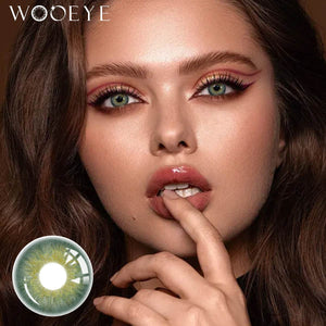 The girl's face is looking straight ahead, the upper left is the Wooeye logo, and the lower left is a close-up of the Origin Glow Blue contact lens