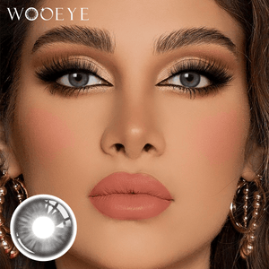 The girl's face is looking straight ahead, the upper left is the Wooeye logo, and the lower left is a close-up of the Peach Gray contact lens