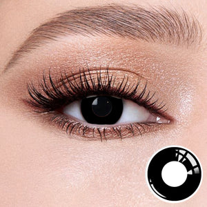 The effect of wearing Ring Black Contact Lenses, with a close-up of the product in the lower right corner