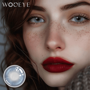 The girl's face is looking straight ahead, the upper left is the Wooeye logo, and the lower left is a close-up of the Snowfall Blue contact lens
