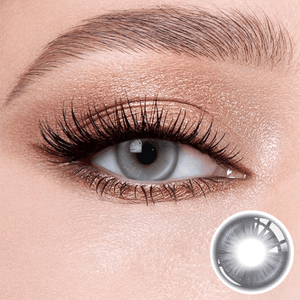 Snowfall Gray Blue contact lenses on the eyes, close-up of the product on the lower right