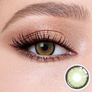 The effect of wearing Sugar Green Contact Lenses, with a close-up of the product in the lower right corner