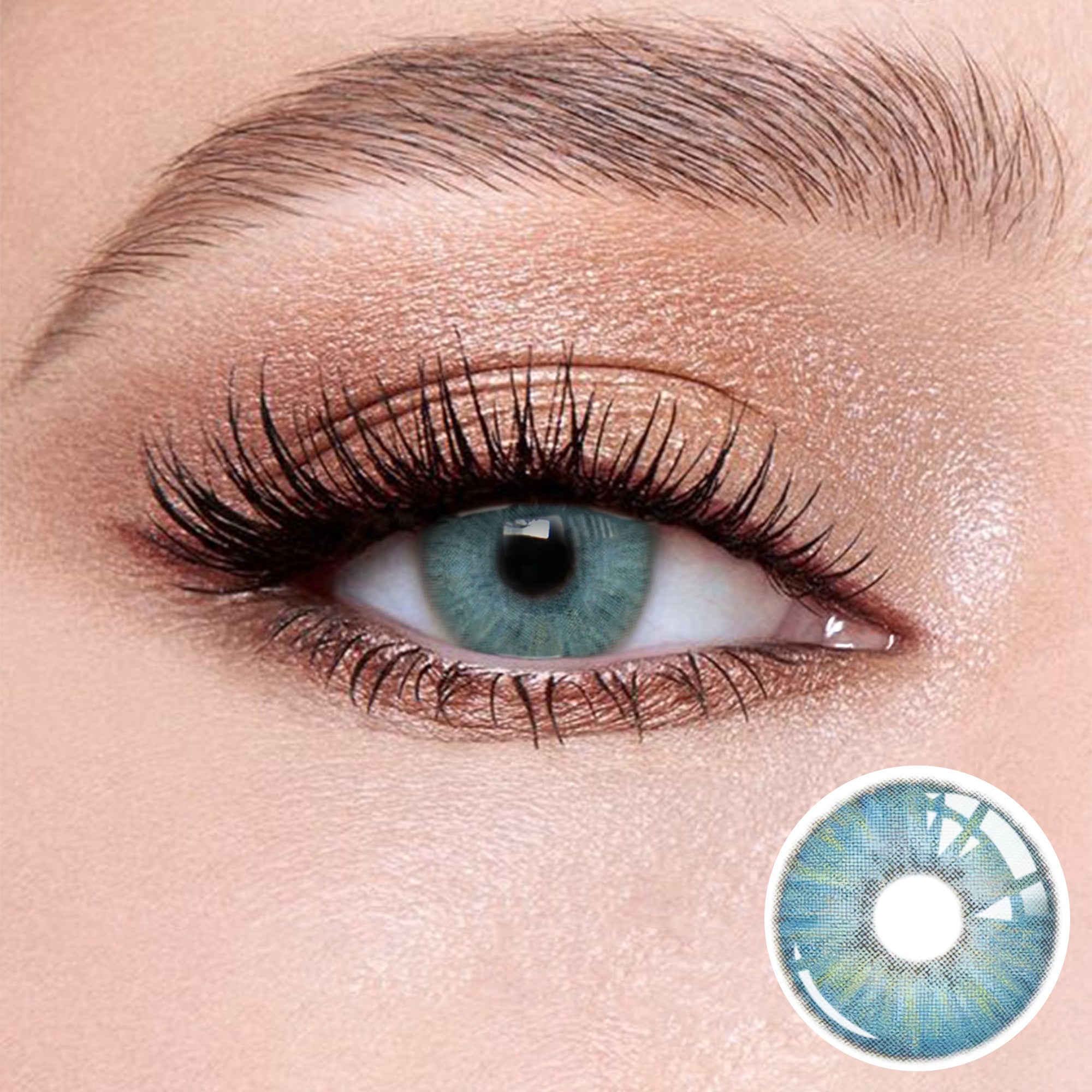 The effect of wearing  Transform Blue Contact Lenses, with a close-up of the product in the lower right corner