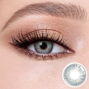 The effect of wearing Omg Green Contact Lenses, with a close-up of the product in the lower right corner