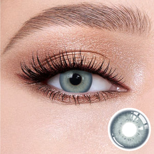 The effect of wearing Charm Green Contact Lenses, with a close-up of the product in the lower right corner