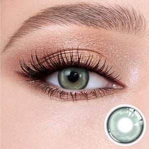 The effect of wearing Heaven Green Contact Lenses, with a close-up of the product in the lower right corner