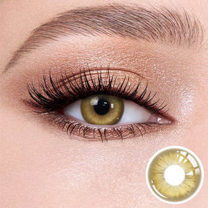 Amber Brown contact lenses on the eyes, close-up of the product on the lower right