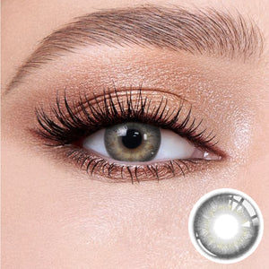 The effect of wearing Banshe Gray Contact Lenses, with a close-up of the product in the lower right corner