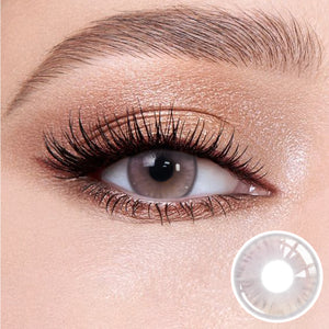 The effect of wearing Princess Pink Contact Lenses, with a close-up of the product in the lower right corner