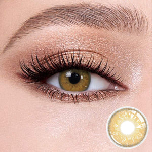 Russian brown contact lenses on the eyes, close-up of the product on the lower right