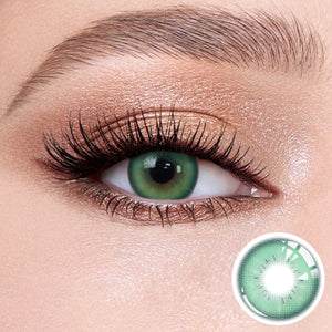 The effect of wearing Romantic Green Contact Lenses, with a close-up of the product in the lower right corner