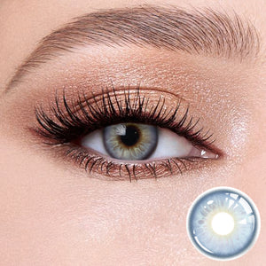 Sweet Light Blue contact lenses on the eyes, close-up of the product on the lower right