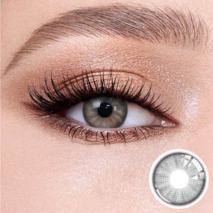 Trends Gray contact lenses on the eyes, close-up of the product on the lower right