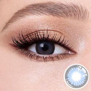 The effect of wearing Diamond Blue Contact Lenses, with a close-up of the product in the lower right corner